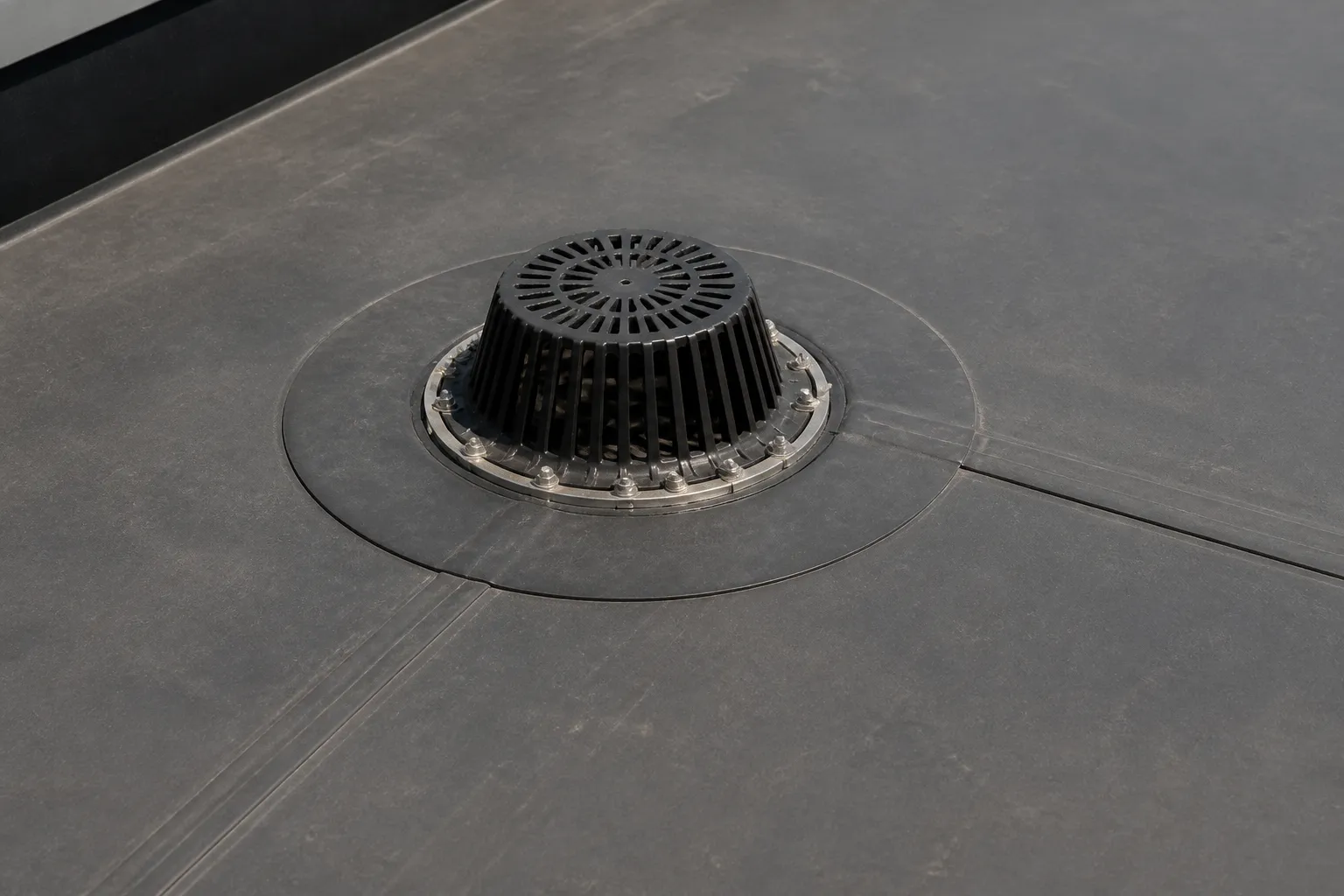 Commercial membrane seams and flashing integrated with a roof drain