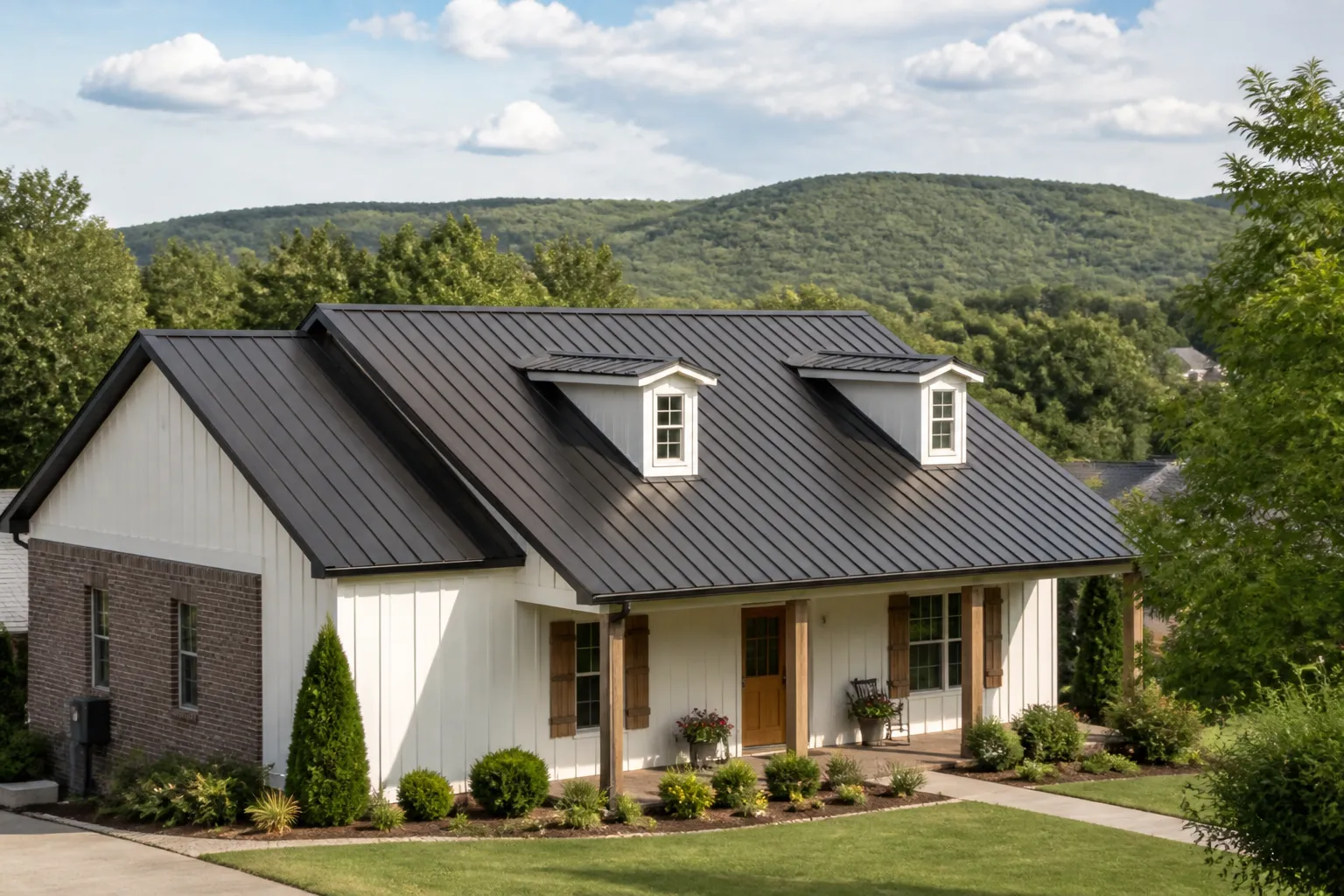 Farmington, Arkansas home with a standing-seam metal roof and wooded hills in the distance