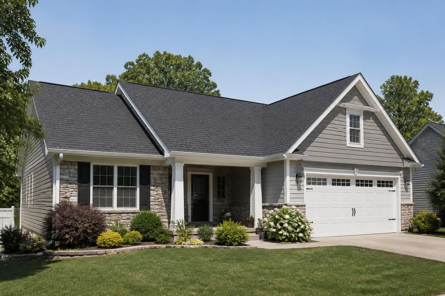 Suburban home with a newly replaced roof and tidy front yard.