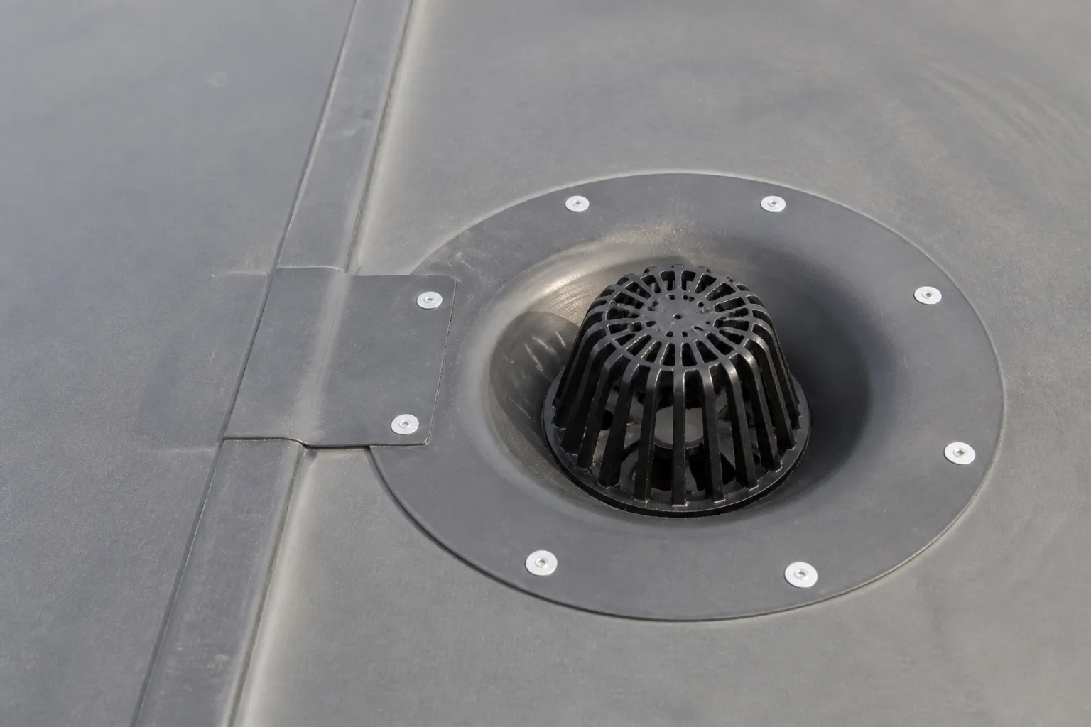Commercial membrane roof drainage bowl and seam with integrated flashing